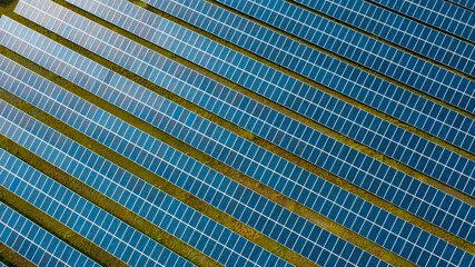 Solar Photovoltaic of solar farm aerial view, solar plant rows array of on the water mount system...