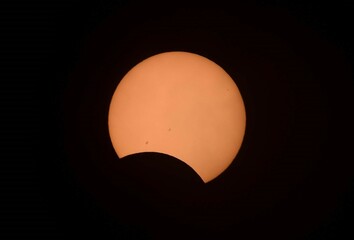 the final stages of the october 14, 2023,  solar annular eclipse as seen from broomfield, colorado