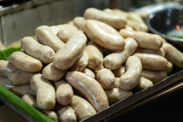 Thai sausage grilled on stall in night market in Chiang Mail, Thailand 