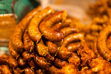 Thai sausage grilled on stall in night market in Chiang Mai, Thailand 