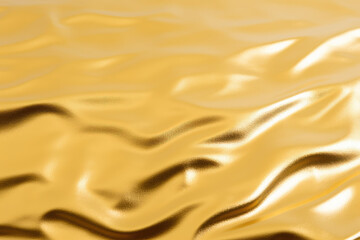 Golden satin background close up with some folds and highlights in it