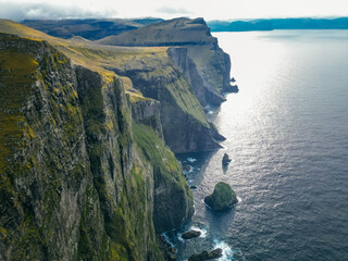 Impression of the wild Faroe coast in the North Atlantic. Paralyzing cliffs