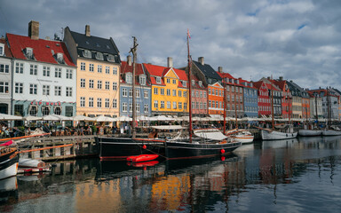 Fototapeta na wymiar Copenhagen iconic view. Famous old Nyhavn port in the center of Copenhagen, Denmark during winter sunny day