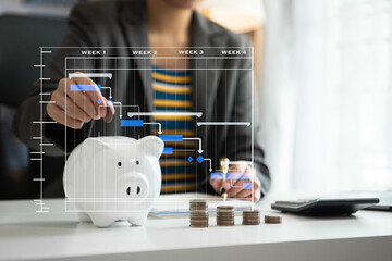 Business woman hand putting money coin into piggy bank with step of growing stack coins for saving money with virtual icon
