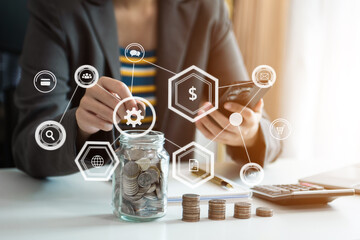 Hand putting mix coins and seed in clear bottle and business investment growth concept. at office..
