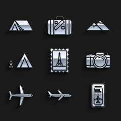 Set Postal stamp and Eiffel tower, Plane, Smartphone with electronic boarding pass airline ticket, Photo camera, Tourist tent wood fire, Mountains and icon. Vector