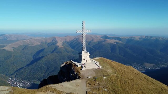 Aerial drone View of the Cross of Heroes on Mount Caraiman in the Bucegi Mountains, Romania. The Commemorative Cross to the Romanian Heroes of the First World War located at 2,291 m altitude