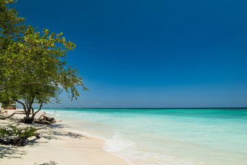 Tropical sandy beach with turquoise ocean at Gili Trawangan, one of the Gili islands in Lombok,...