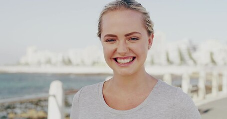 Fitness, face and wink by happy woman at a a beach for training, run or morning cardio. Exercise, portrait and female runner with flirt emoji at the sea for running, wellness or workout in nature - Powered by Adobe