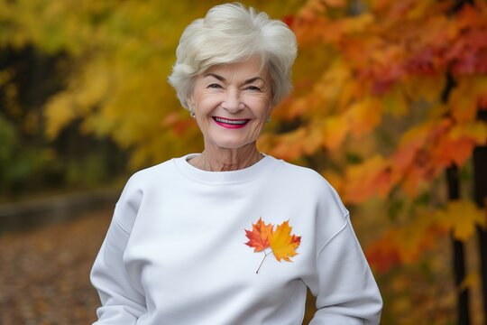 Smiling older woman with autumn leaves background. Adult female in casual fall outfit. Generate ai