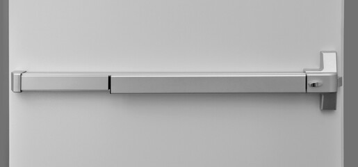 Emergency exit door. Push bar and rail for panic exit