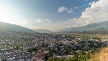 Panorama showing sunset over Gjirokastra city from the viewpoint of the fortress of the Ottoman castle of Gjirokaster timelapse.