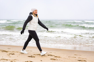 Beautiful woman walking on beach