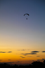 Paraglider over sunset