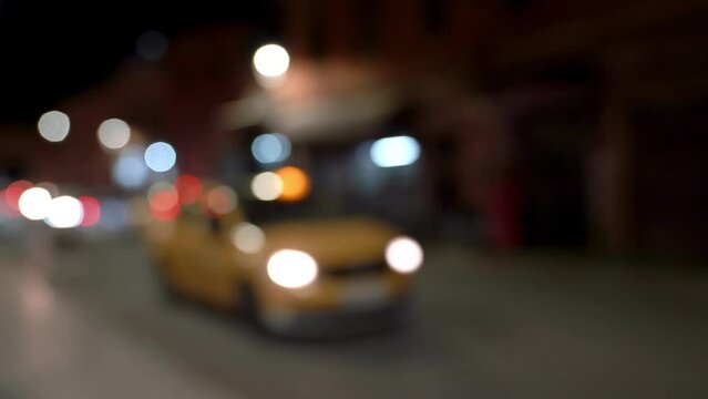 Busy traffic at night in a busy city street. Out of focus and bokeh video done on purpose.