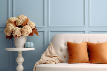 A bouquet of dry hydrangea in a vase in the interior of a blue living room. Autumn atmosphere.