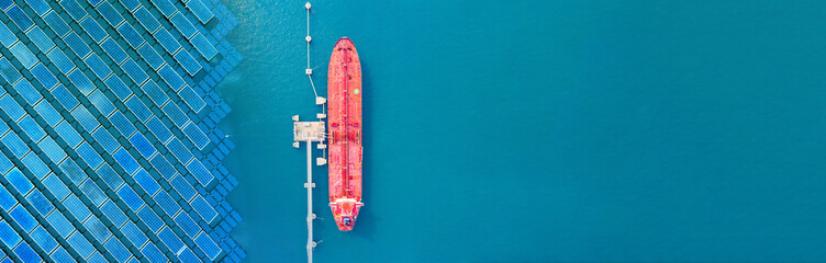 Aerial top view pipeline transport. natural gas pipeline for oil delivery ships. Oil tanker ship to...