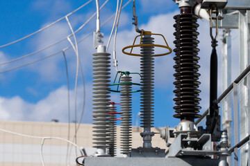 Electrical substation close-up. Electrical components. Electrical substation against the blue sky. 