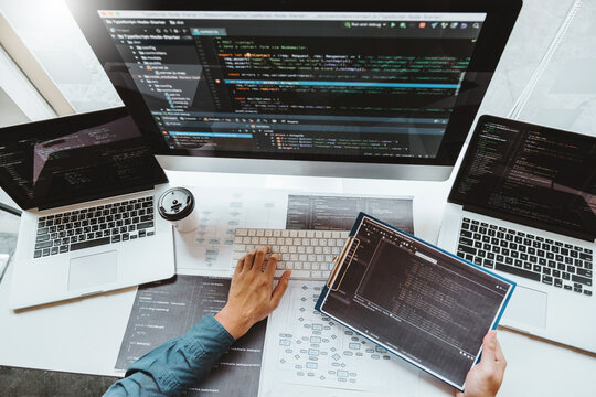 Developing programmer Development Website design and coding technologies working in software company office