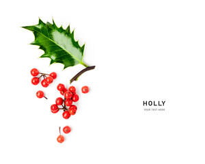 Holly leaves red berry christmas decoration isolated on white background .