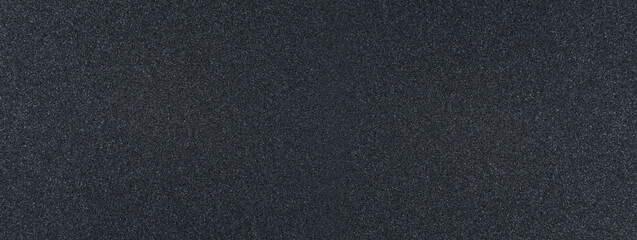 Background filled with black particles.