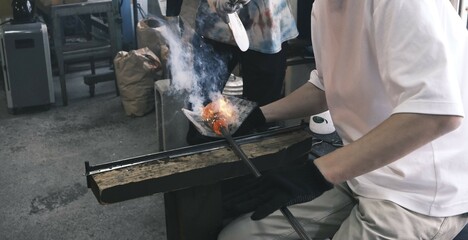 welder at work with burning glass