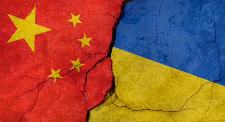 Flags of China and Ukraine, texture of concrete wall with cracks, grunge background, military conflict concept