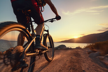 Young man riding bicycle on mountain trail sport