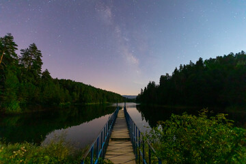 Bozcaarmut pond at night blue pier and milky way