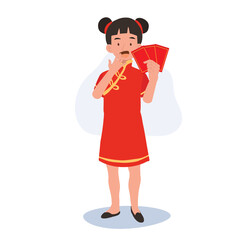 Cute Little Boy in Traditional Chinese Attire Holding Red Envelope. Happy Chinese new year.