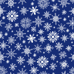 Winter seamless pattern with snowflakes on blue background. Vector illustration in hand drawn doodle style for Christmas and New Year design, decor, wallpaper, textile, packaging and print.