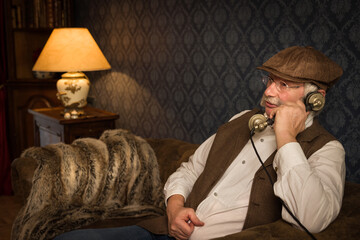 Victorian senior sitting on sofa