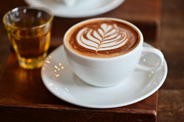 high angle view of coffee cup on wood grain table Drinking Concept: Hot Coffee, Latte, Espresso, Cappuccino