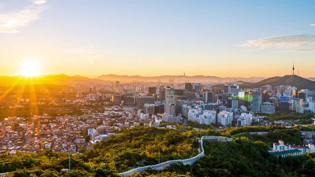  Time lapse Landscape of Seoul South Korea in the morning and the golden sun shines on the city.