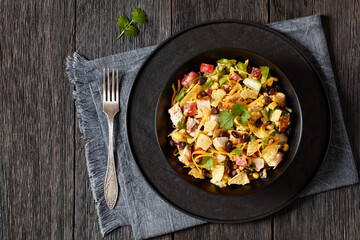 mexican rotisserie chicken salad in black bowl