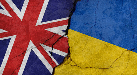 Great Britain and Ukraine flags, concrete wall texture with cracks, grunge background, military conflict concept