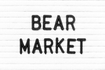 Black color letter in word bear market on white felt board background