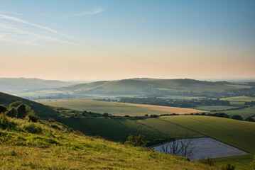 Stunning Summer sunset from Firle Beacon in South Downs National Park in beautiful English countryside - 662280984