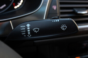 Wipers switch control isolated. Adjusting speed of screen wipers in car. Wiper switch toggle.  - obrazy, fototapety, plakaty