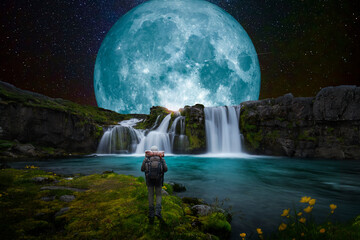 Blue Moon over great waterfall