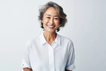 Rolgordijnen Portrait of Asian senior woman posing on white wall background. © Virtual Art Studio