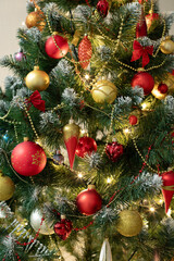 Red baubles and decorations on christmas tree for background. New Year concept.