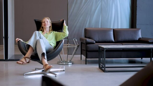 Woman sitting in her office chair and spinning