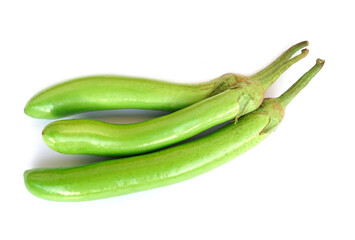 Green long eggplants isolated on white background. Concept, agriculture crop in Thailand. Food ingredient which can be cooked for variety delicious menu. Healthy eating, high fiber, reduce cholesterol