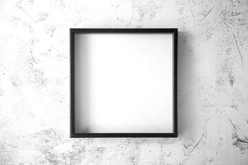 The black square frame is on a textured light with gray splashes  background in the center of the image. View from the top. Copy space.