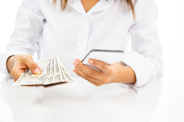 Woman hand hold smartphone and money