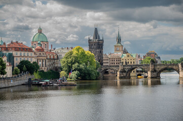 Prague - Charles bridge, Czech Republic. Scenic aerial sunset on the architecture of the Old Town...