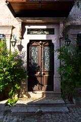 Wooden brown door of nostalgic house in Cunda Island, Ali Bey Island, Ayvalik, Balikesir, Turkey...