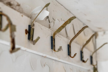 old abandoned dilapidated coat hooks