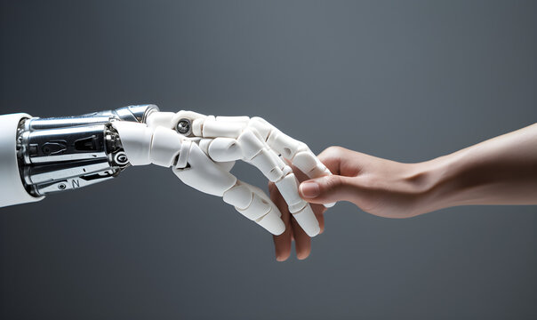 A white AI robot's hand touching a human hand, symbolizing future living, human-machine interaction, and collaboration between humans and machines.